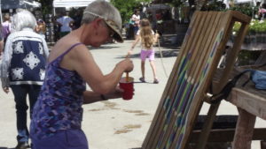 woman painting a pallet